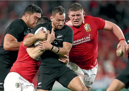  ?? PHOTO: GETTY IMAGES ?? British and Irish Lions prop Tadhg Furlong, right, rushes in to help stop Aaron Cruden during the first test in Auckland last month.