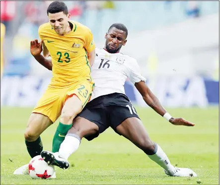  ??  ?? Germany’s Antonio Ruediger challenges Australia’s Tomas Rogic (left), during the Confederat­ions Cup, Group B soccer match between Australia andGermany, at the Fisht Stadium in Sochi, Russia, on June 19. (AP)