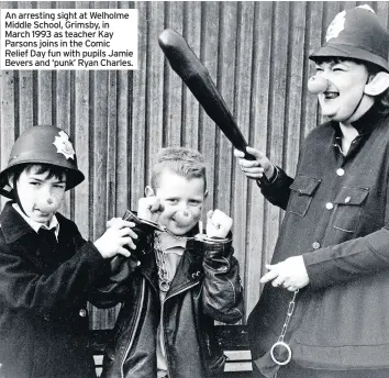  ??  ?? An arresting sight at Welholme Middle School, Grimsby, in March 1993 as teacher Kay Parsons joins in the Comic Relief Day fun with pupils Jamie Bevers and ‘punk’ Ryan Charles.