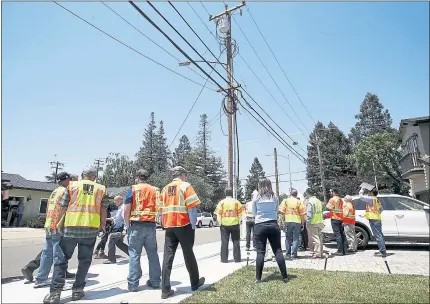  ?? PHOTOS BY KARL MONDON — STAFF PHOTOGRAPH­ER ?? Members of the California Public Utilities Commission take a field trip to Curtiss Avenue in San Jose to look at utility pole problems.