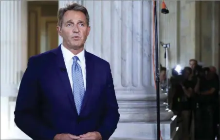  ?? MANUEL BALCE CENETA — THE ASSOCIATED PRESS ?? Sen. Jeff Flake, R-Ariz., speaks during a television interview on Capitol Hill in Washington, Tuesday. Flake announced he would not run for reelection in 2018, condemning in a speech aimed at President Donald Trump the “flagrant disregard of truth and...