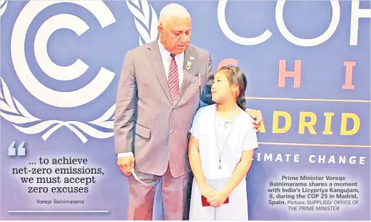  ?? Picture: SUPPLIED/ OFFICE OF THE PRIME MINISTER ?? Prime Minister Voreqe Bainimaram­a shares a moment with India’s Licypriya Kangujam, 8, during the COP 25 in Madrid, Spain.