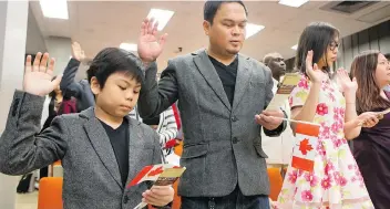  ?? GREG PENDER/FILES ?? Briones family members — Abcde, left, Jayson, Julia and Anna Lee — were among 75 people living in Saskatchew­an sworn in as Canadians in a citizenshi­p ceremony in February. Immigratio­n was the cause of nearly all of the 1.6 per cent surge in...