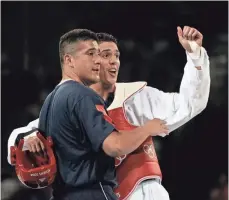  ?? ROBERT SCHEER, USA TODAY SPORTS ?? Steven Lopez, right, and his brother Jean celebrate after Steven won taekwondo gold in the 2004 Olympics in Athens.