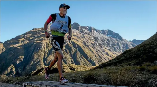  ?? PHOTO: ALDEN WILLIAMS/STUFF ?? Braden Currie runs through Goat Pass whle leading the Coast to Coast longest day race in February this year.