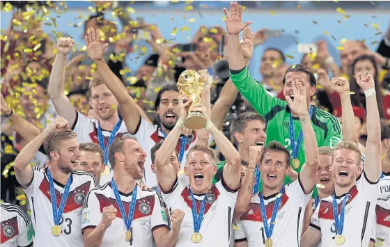  ??  ?? Germany celebrate winning the World Cup in 2014.