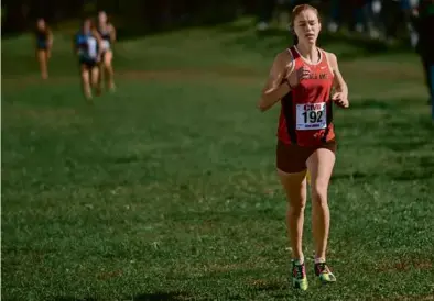  ?? ANDREW BURKE-STEVENSON FOR THE GLOBE ?? Oliver Ames’s Katie Sobieraj has clear sailing to the finish line Saturday at Franklin Park.