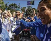  ?? LOUISE DELMOTTE / ASSOCIATED PRESS ?? Visitors arrive at the World of Frozen themed area during its opening ceremony at Disneyland Resort in Hong Kong, on Nov. 20.