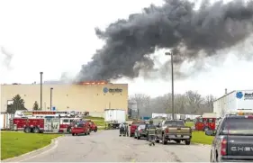  ?? MATTHEW DAE SMITH / LANSING STATE JOURNAL ?? Emergency personnel respond to a fire earlier this month at Meridian Magnesium Products of America in Eaton Rapids, Mich. The fire that damaged the auto parts supply factory is causing production problems at Ford, Fiat Chrysler and General Motors, but...