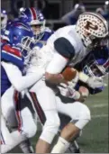  ?? RANDY MEYERS — THE MORNING JOURNAL ?? Bay defenders tackle Cameron Drum of Padua during the first quarter on Nov. 10. The Rockets’ swarming defense will need to be sharp against a tough Toledo Central Catholic team.