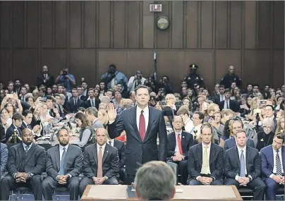  ?? AP PHOTO ?? Former FBI Director James Comey is sworn in by Chairman Richard Burr, R-N.C, during a Senate Intelligen­ce Committee hearing on Capitol Hill Thursday.