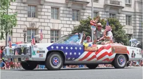  ??  ?? A decked-out Cadillac rolls down Constituti­on Avenue in “America’s Independen­ce Day Parade” in Washington, D.C., on Thursday.