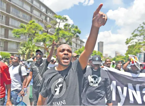  ?? ?? Protests against power cuts in Pretoria on Friday. Andre de Ruyter, below, has quit as head of national power firm Eskom