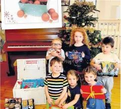  ?? 171219CROF­TAMIE_01 ?? Christmas cheer Gift
Children from Croftamie Nursery supported Give A