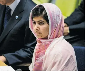  ?? ANDREW BURTON/GETTY IMAGES ?? Malala Yousafzai, the 16-year-old Pakistani advocate for girls’ education who was shot in the head by the Taliban, prepares to give her speech at the United Nations Youth Assembly on Friday.