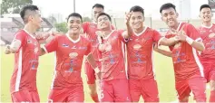  ??  ?? Sabah’s No. 16 Ariusdius Jais (gesturing in the centre) is embraced by team-mates after he put Sabah ahead with a well-taken penalty in the President’s Cup Group A match against Armed Forces. Sabah won 1-0. - Photo courtesy of Augustine Jumat