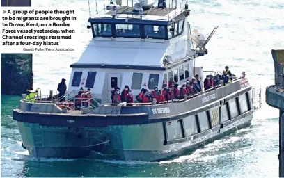  ?? Gareth Fuller/Press Associatio­n ?? A group of people thought to be migrants are brought in to Dover, Kent, on a Border Force vessel yesterday, when Channel crossings resumed after a four-day hiatus