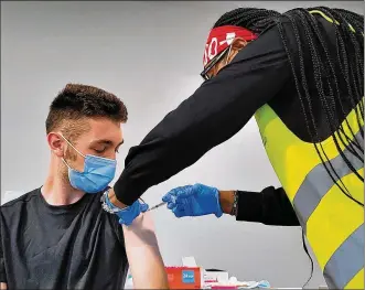  ?? NICK GRAHAM / STAFF ?? Mainstream health care profession­als are fairly like-minded when it comes to the role vaccines play in getting the COVID-19 pandemic under control. Says Dr. Adam Mezoff of Dayton Children’s: “A wellvaccin­ated community stands stronger and better than one that isn’t.”