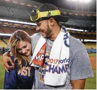  ?? Jae C. Hong / Associated Press ?? Rodriguez takes it all in after Correa’s proposal in Los Angeles that followed the championsh­ip game.