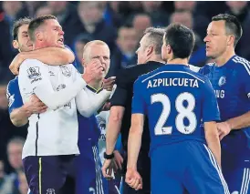  ??  ?? Chelsea’s Branislav Ivanovic, left, grapples with Everton’s James McCarthy.