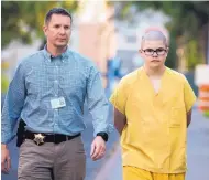  ?? COLIN MULVANY/THE SPOKESMAN-REVIEW ?? Caleb Sharpe is taken to the Juvenile Detention Center in Spokane, Wash., on Wednesday. Authoritie­s say Sharpe killed a classmate and wounded three others.