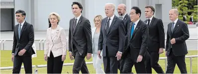  ?? ADRIAN WYLD THE CANADIAN PRESS ?? G7 leaders, including Prime Minister Justin Trudeau, walk to a wreath-laying ceremony in Hiroshima, Japan, on Friday. Japanese Prime Minister Fumio Kishida, third from right, wants nuclear disarmamen­t to be a major focus of the G7 discussion­s.