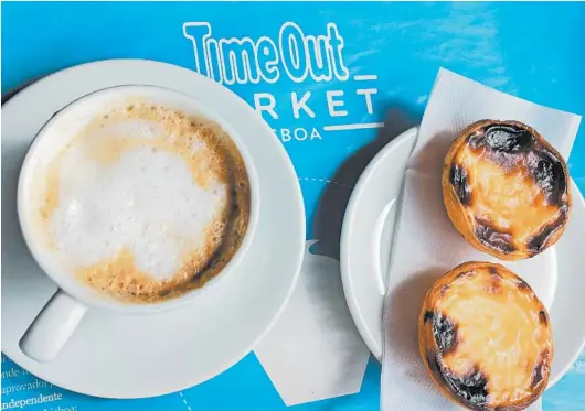  ?? DEBRA BRUNO/THE WASHINGTON POST ?? Pasteis de nata are the only food item offered at the Manteigari­a cafe in the Time Out Market at the Mercado da Ribeira near the Lisbon waterfront.