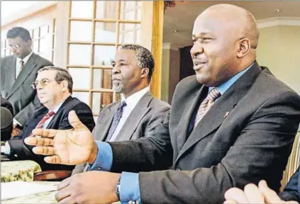  ?? Photo: Reuters ?? ‘Stability paramount’: Chris Stals (left), who was Reserve Bank governor at the time of the bailouts, with his successor Tito Mboweni (right) and former president Thabo Mbeki.