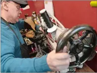  ?? ?? Jairo Cardenas, owner of the Alpha Shoe Repair Corp., works on a boot repair last month in New York.