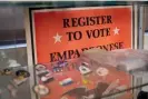  ?? Marlena Sloss ?? A sign posted among a display of election pins at the Shasta county registrar of voters office urges people to register to vote. Photograph: