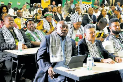  ?? AP ?? South African President Cyril Ramaphosa, first row left, listens in Johannesbu­rg to the ruling from the top UN court that harshly criticised Israel’s war against Hamas. Israeli Prime Minister Benjamin Netanyahu says Israel will “continue to do what is necessary” to defend itself.