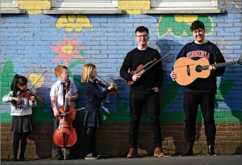  ?? Pictures: Jamie Simpson ?? „ Left to right, Maria Isaac, Lewis Gale and Lexy Pullar, from Thorntree Primary School in Shettlesto­n, are joined by 2019 BBC Scotland Young Traditiona­l Musician of the Year Benedict Morris and Charlie Galloway at the launch of the What’s Going On? study findings into music education.