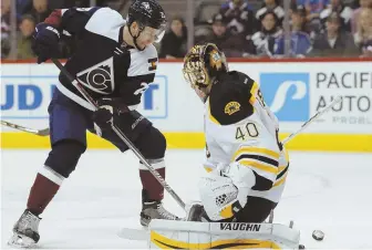  ?? AP PHOTO ?? ZEROED IN: Tuukka Rask makes a stop on the Avalanche’s Mikhail Grigorenko last night in Denver, one of Rask’s 21 saves in the Bruins’ 2-0 victory.