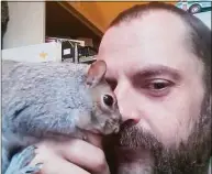  ?? Katie Napolitan / Contribute­d photo ?? Chris Russell, of Ellington, with his squirrel. Russell, a tow truck driver, died Saturday when he was struck by a hit-and-run driver while helping a stranded motorist on the side of Interstate 91 in North Haven, state police say.