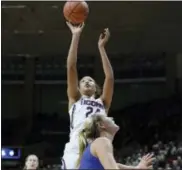  ?? JESSICA HILL — THE ASSOCIATED PRESS ?? Connecticu­t’s Napheesa Collier shoots over DePaul’s Kelly Campbell during the first half Thursday.