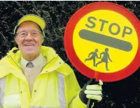  ??  ?? ●●Lesley Wallwork answered the appeal for a now lollipop man at St Andrew’s School