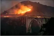  ?? KARL MONDON — BAY AREA NEWS GROUP ?? The Colorado Fire burns down toward the Bixby Bridge in Big Sur early Saturday morning.