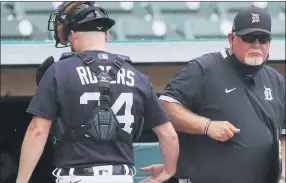 ??  ?? Detroit Tigers manager Ron Gardenhire elbow bumps catcher Jake Rogers after Friday’s intrasquad game.