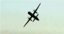  ?? AFP ?? A FRAME GRAB taken from footage filmed by bystander John Wauldron on Aug. 10 with his Galaxy S8 at Chambers Bay Park and Golf Course in University Place Washington, shows an empty passenger airplane, stolen from the SeattleTac­oma airport, making an unlikely upside-down aerial loop, then flying low over Puget Sound before crashing into the sparsely populated Ketron Island in the northweste­rn US state of Washington.