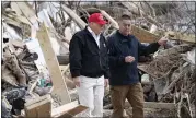  ?? ALEX BRANDON — THE ASSOCIATED PRESS ?? President Donald Trump speaks with Mike Herrick, with Putnam County Rescue Squad, in Cookeville, Tennessee.