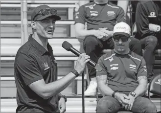  ?? DARRON CUMMINGS/AP PHOTO ?? Alex Palou, of Spain, speaks as Tony Kanaan, of Brazil, looks on during the drivers meeting for the Indianapol­is 500 on Saturday at Indianapol­is Motor Speedway in Indianapol­is.