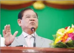  ?? HENG CHIVOAN ?? Sar Kheng speaks at Phnom Penh’s National Education Institutio­n yesterday.