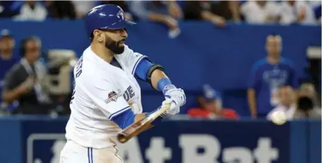  ?? STEVE RUSSELL/TORONTO STAR ?? Jays outfielder Jose Bautista hit a sixth-inning home run to pull Toronto within a run of Texas, but he was forced to leave Game 1 early with leg problems.