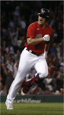  ?? GeTTy imageS pHoToS ?? SOMETHING TO SAY: Hunter Renfroe shouts toward his dugout after tossing his bat following his two-run home run during the seventh inning Friday night against the Indians at Fenway Park. At left, Kyle Schwarber gestures toward the dugout after his two-run double during the seventh.