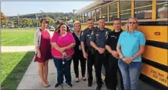  ?? SUBMITTED PHOTO ?? Pictured with police are Stephanie Mitchell, operations manager for Krapf Bus Co.; Danyel Stutzman, the bus driver; Lori Aguilera and Sue Liskey, safety officer for Krapf Bus Co. Coatesvill­e police are Lt. James Audette, Sgt. Rodger Ollis and Officer...