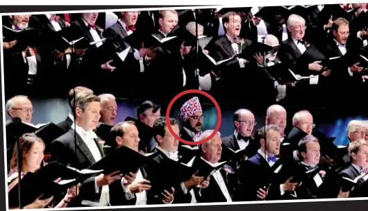  ??  ?? Full-voiced patriotism: Mr Sidhu, circled, sings Land of Hope and Glory with the BBC’s Symphony Chorus