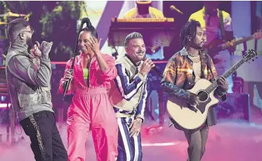  ?? Valerie Macon / AFP via Getty Images ?? Farruko, from left, Alicia Keys, Pedro Capo and Miguel perform Thursday during the 20th annual Latin Grammy Awards in Las Vegas. Capo won song of the year for “Calma.”