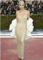  ?? EVAN AGOSTINI/INVISION ?? Some Marilyn Monroe fans believe this dress was damaged after Kim Kardashian wore it May 2 at the Met Gala, but Ripley’s denies that claim.