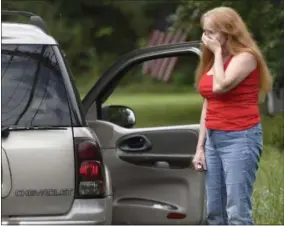  ?? STEVE RUARK — THE ASSOCIATED PRESS ?? Shirley Pollack, of Perryville, Md. reacts to what authoritie­s have called a shooting with multiple victims in Perryman, Md. on Thursday. Authoritie­s say multiple people have been shot in northeast Maryland in what the FBI is describing as an “active shooter situation.” Pollack,was concerned about her son who worked near the scene of the shooting.