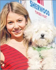 ?? JIM DAY/THE GUARDIAN ?? Jillian Sexton, the chief operating officer of Sherwood Timber Mart, carted her sidekick Bo to work all summer as she worked to grow her new business. The business opened in late May after the assets of the struggling Sherwood BMR were purchased from a...